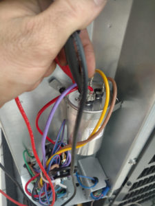 Checking voltage on a run capacitor goodman condensing unit