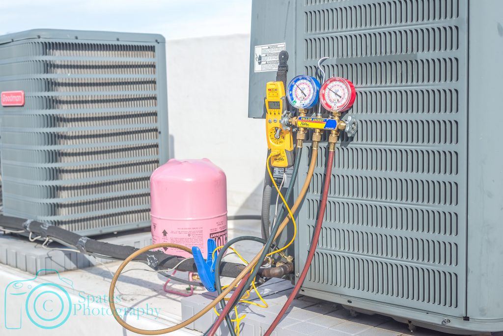 Refrigerant gauges hooked up to running condenser, set to charge with 410a, multi-meter with temp clamp hooked up to liquid line