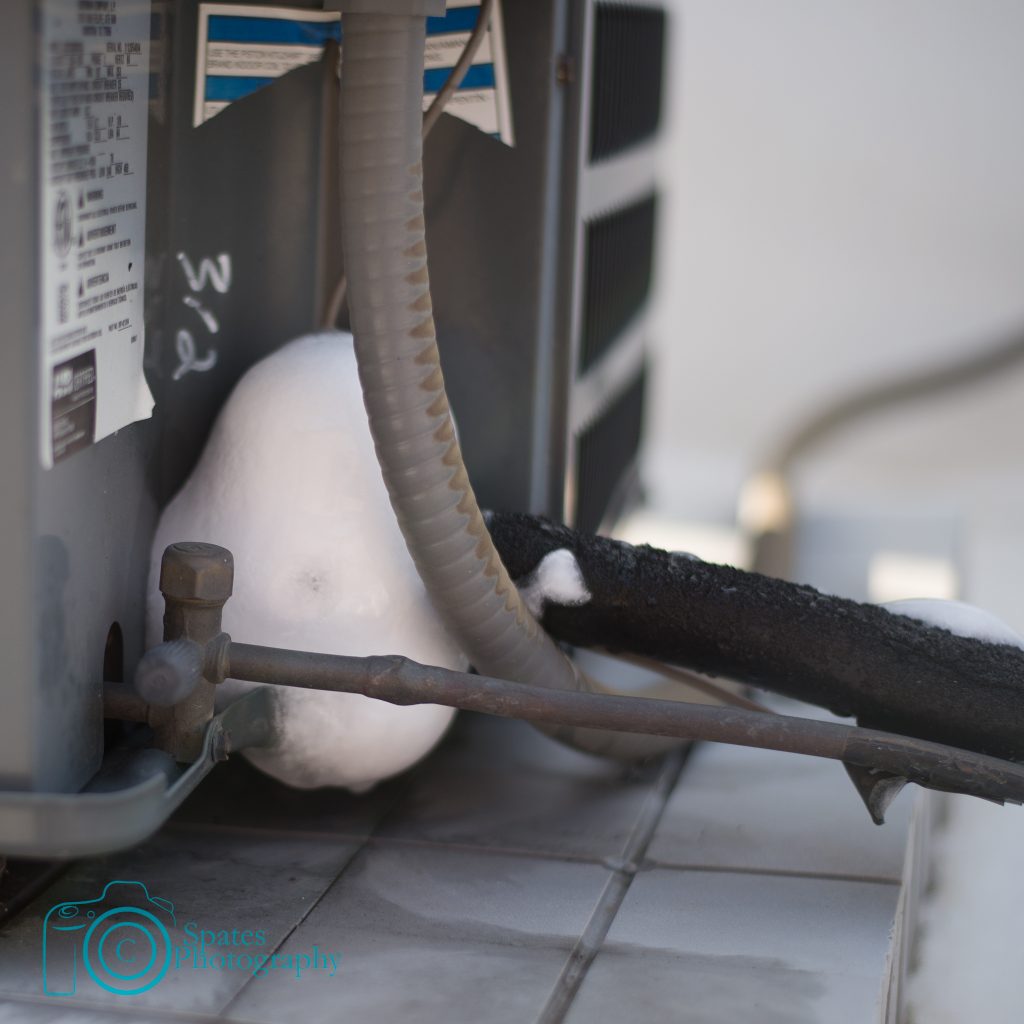 Condensing unit suction line on air conditioner completely frozen up.