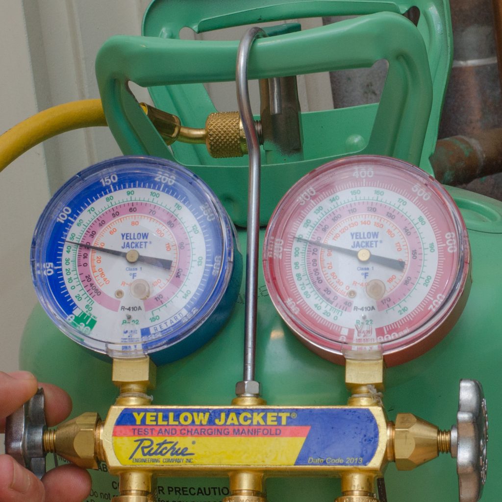 Refrigerant gauges reading pressure and saturation temperature