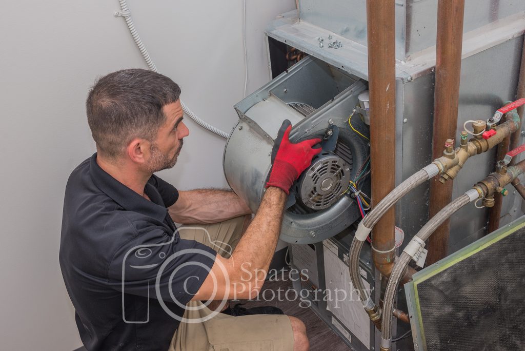 Dave spates hvac technician installing a blower motor on a water sourced heat pump